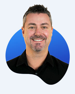 Innervate EVP of Sales and Marketing headshot with black shirt and blue background