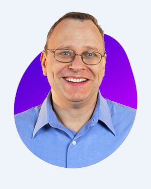Innervate Co-Founder and CTO headshot with blue shirt and purple background